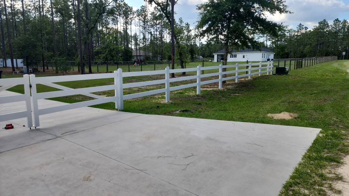 Horse fence, white driveway by Crystalline Home Improvement in Central Florida