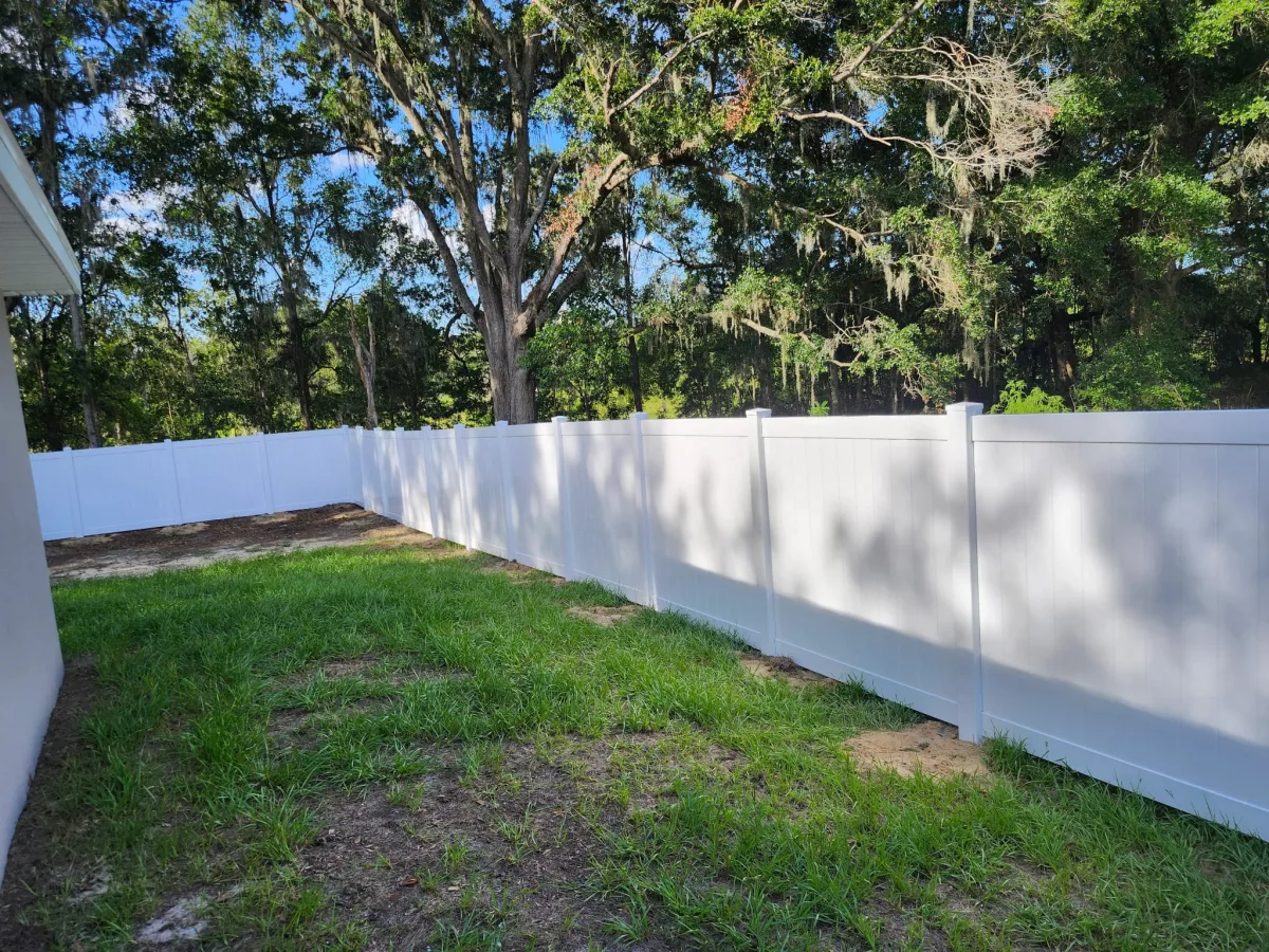 Vinyl privacy, white backyard pool cage by Crystalline Home Improvement in Central Florida