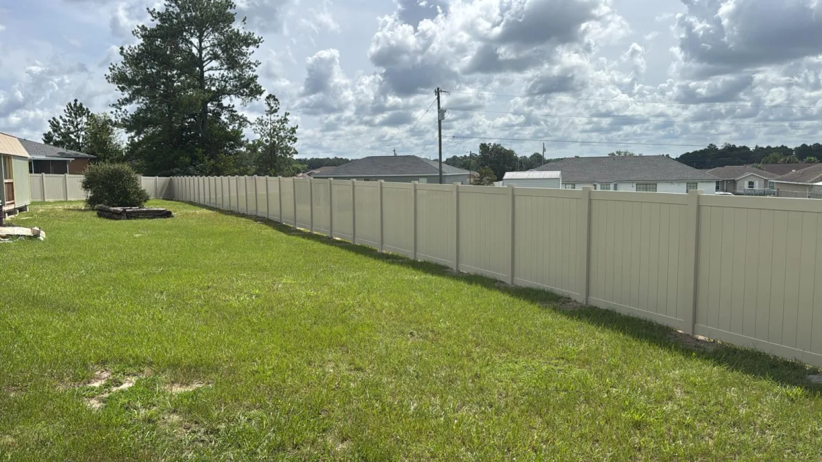 Vinyl privacy, white driveway gate by Crystalline Home Improvement in Central Florida